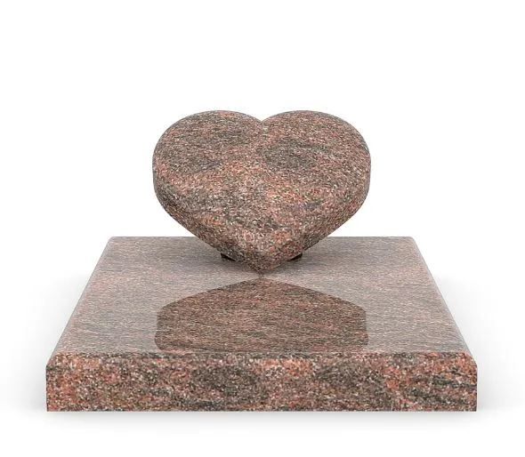 Petit monument cinéraire en granit rose avec stèle en forme de cœur